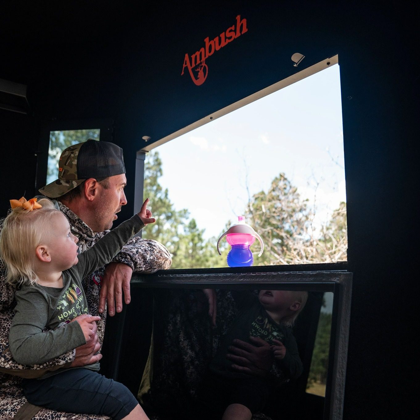 Child and Dad in hunting blind