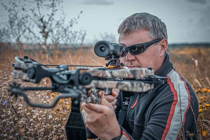 AdobeStock_455052636 small A man with a raised crossbow