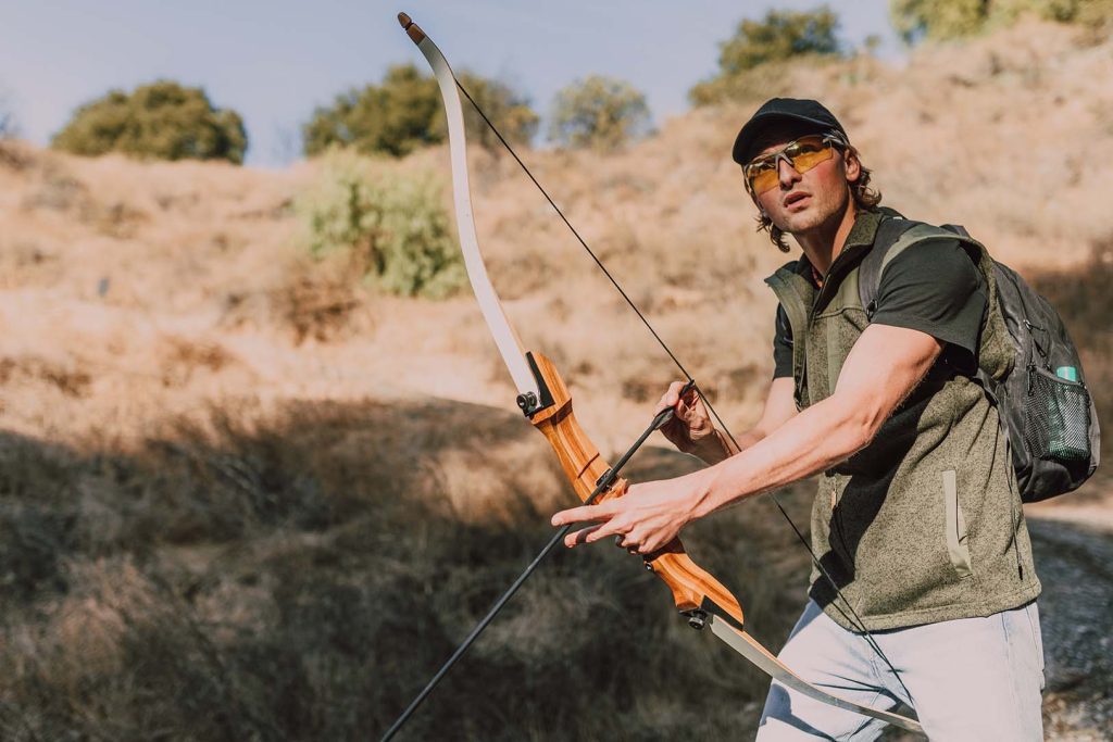 pexels-rodnae-productions-6669386 small a man is bow hunting with a longbow